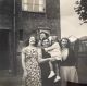 Photo of 4 Women & A Child Outside Of A House